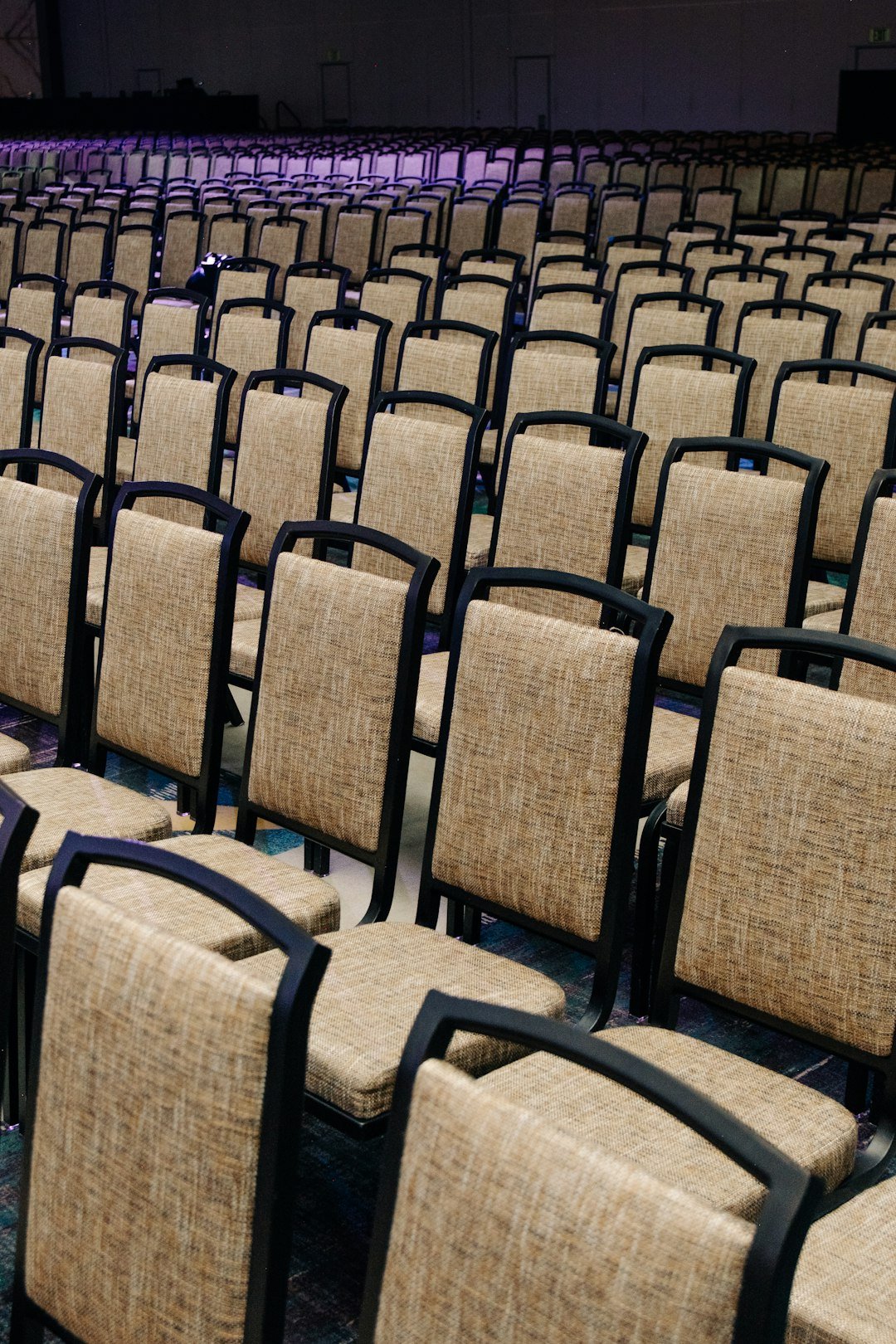 rows-of-empty-chairs-in-a-large-hall-loe0qvadni0